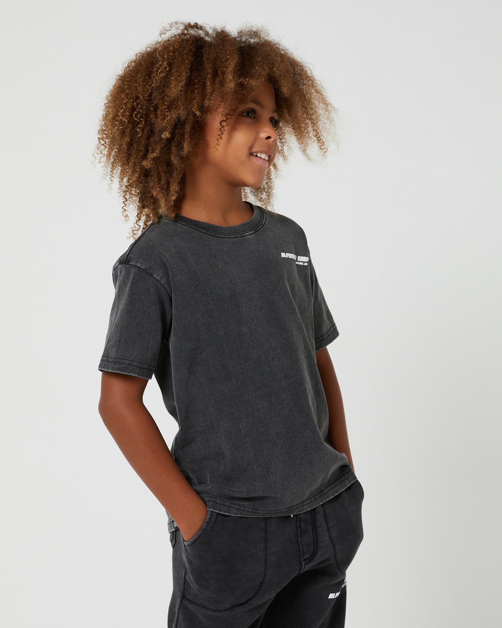 Teen Boys San Clemente Tee from Alphabet Soup. 100% cotton with vintage dye wash. Puff logo print. Straight hemline, short sleeves. Comfortable and casual.