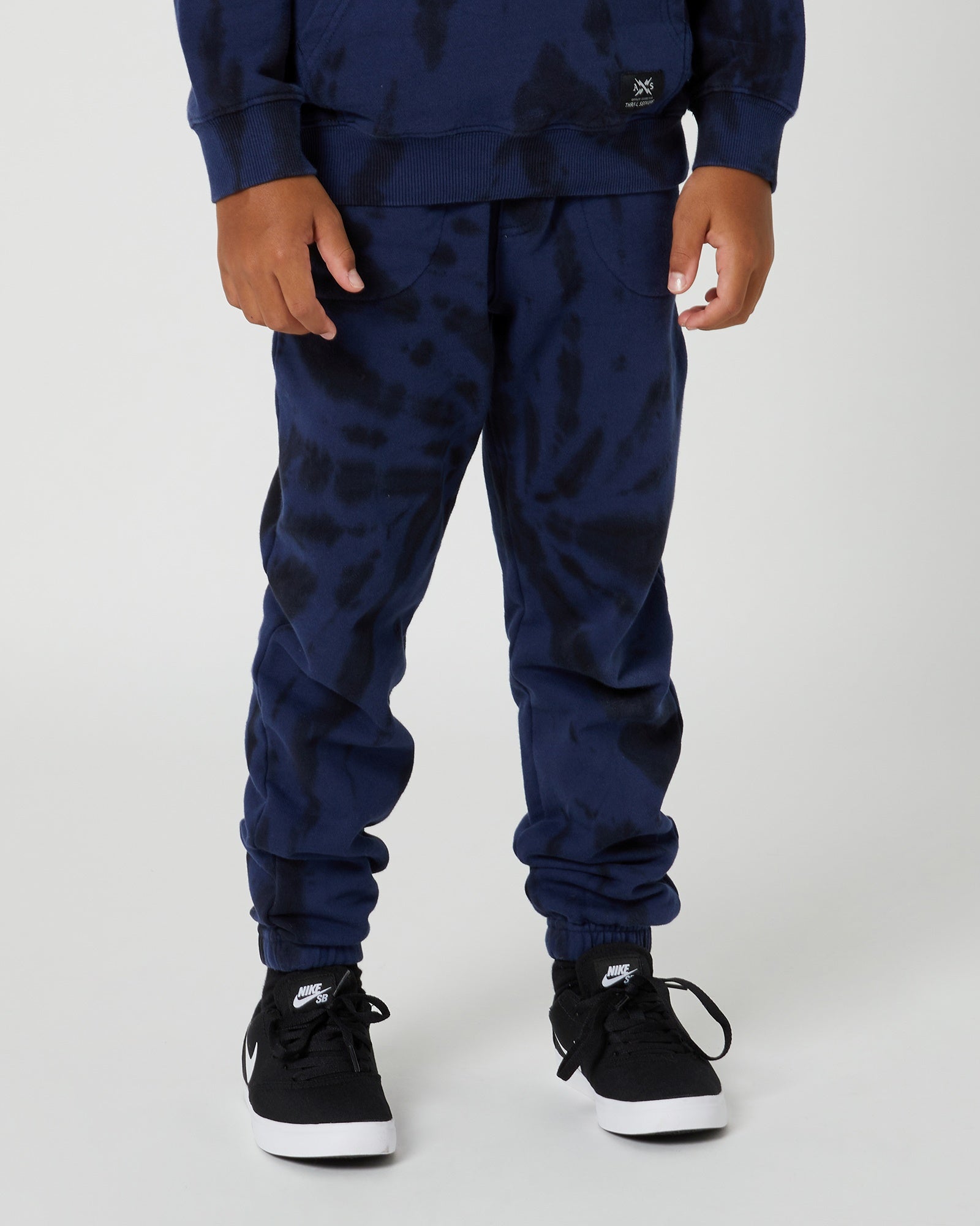 Expertly crafted Kids Box Trackpants by Alphabet Soup with 100% cotton and a blue & black tie dye print. Features a comfortable regular fit, elasticated waist with drawcord, and convenient hand and back pockets.