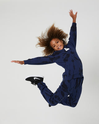 Alphabet Soup Teen Box Hoodie in midnight blue tie dye, made with 100% cotton and a tie-dye fabric, your little skater will love the oversized fit, kangaroo pocket, and logo embroidery patch on the centre chest.