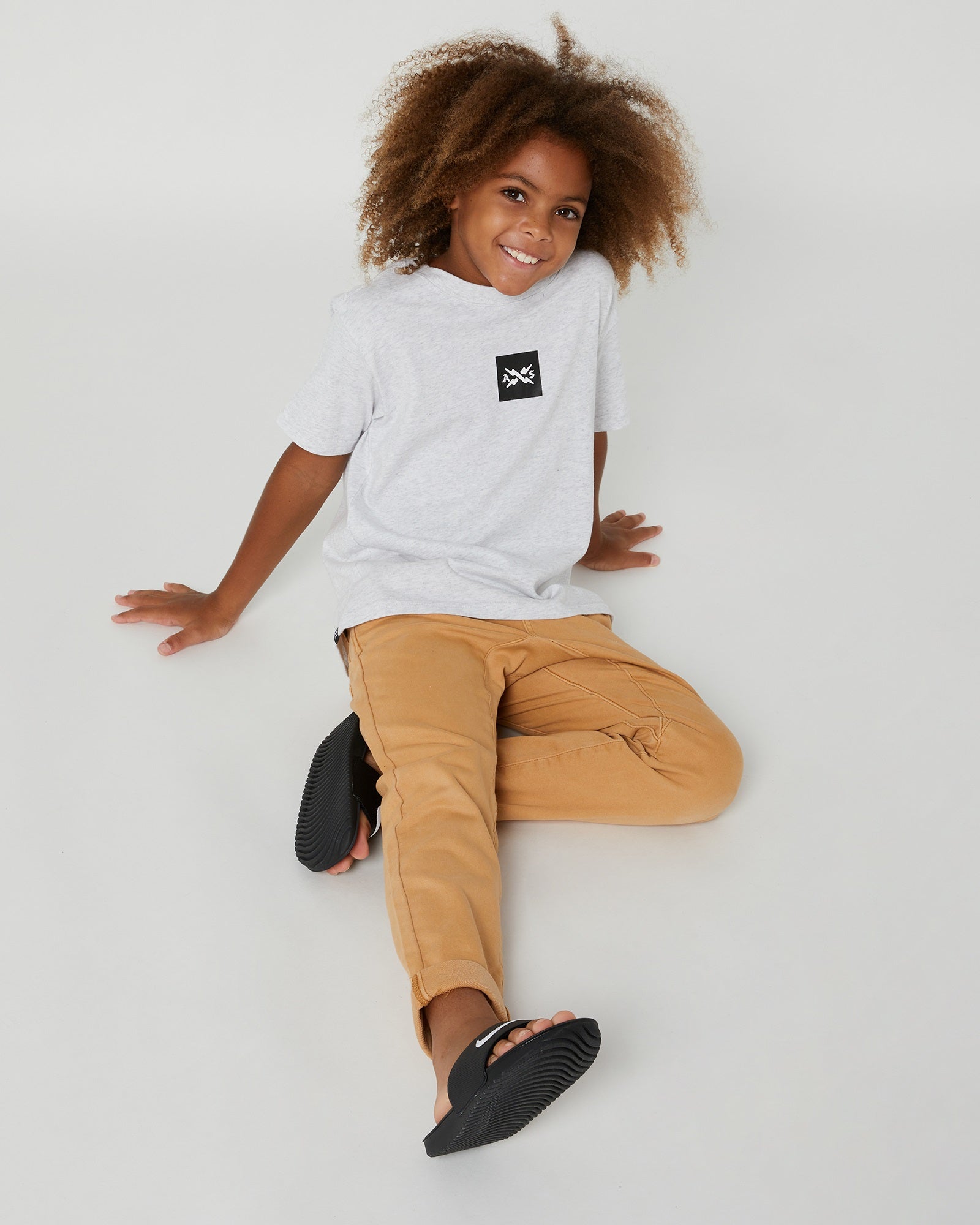 Alphabet Soup's Kids Chino Joggers in Washed Stone are perfect for stylish and comfy little groms. Made with a soft material, these joggers have an elastic waistband, cuffed hem, and back pockets.