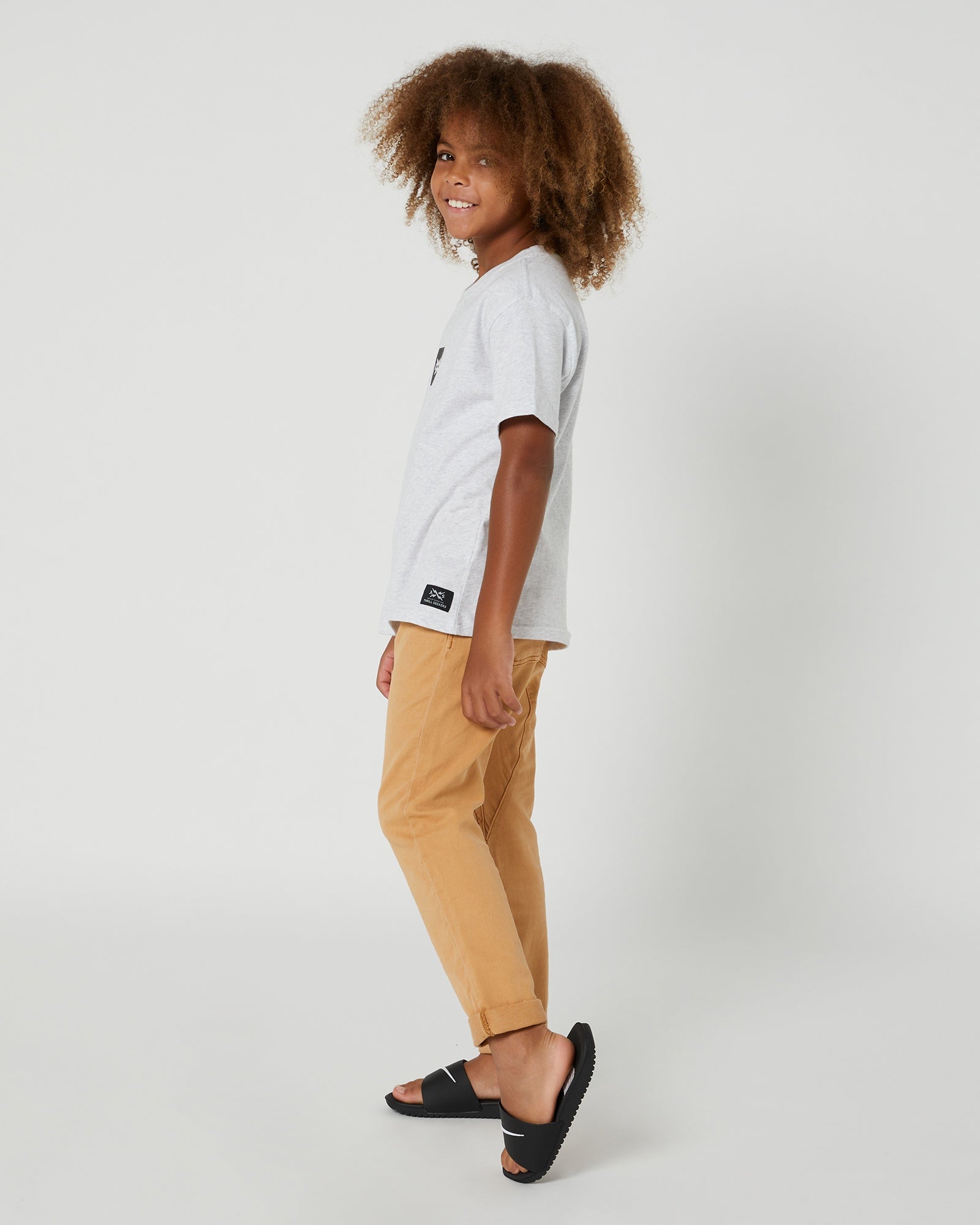 Experience the ultimate in comfort and style with the 100% Grey Marle cotton Kids Box Short Sleeve Tee from Alphabet Soup. Perfect for skateboarding and BMX, this shirt features a roomy box fit and ribbed crew neckline, along with a stylish logo patch.