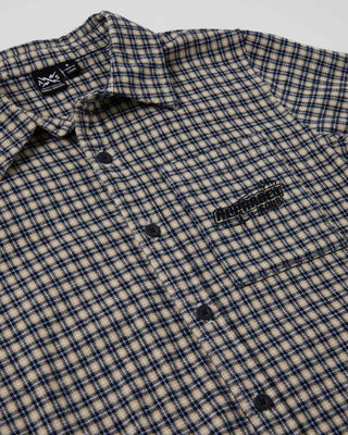 Boys Alphabet Soup's Teen's Check It Short Sleeve Shirt is made from 100% cotton and features a curved hemline, button through placket, and open chest pocket. Ideal for any drop-in, with yarn check fabric and embroidered art.
