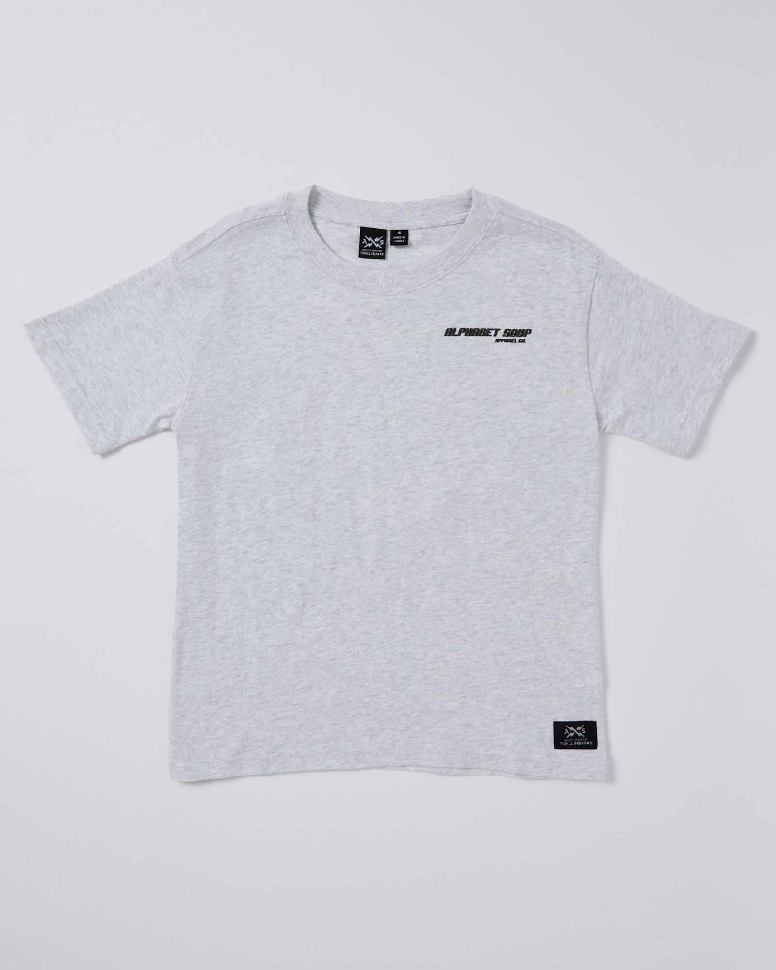  The Kids San Clemente Short Sleeve Tee in cool grey marle. Made from 100% cotton jersey by Alphabet Soup, this t-shirt features a vintage garment dye wash, ribbed crew neckline, puff logo print on the chest and back, and a woven logo patch at the hem. 