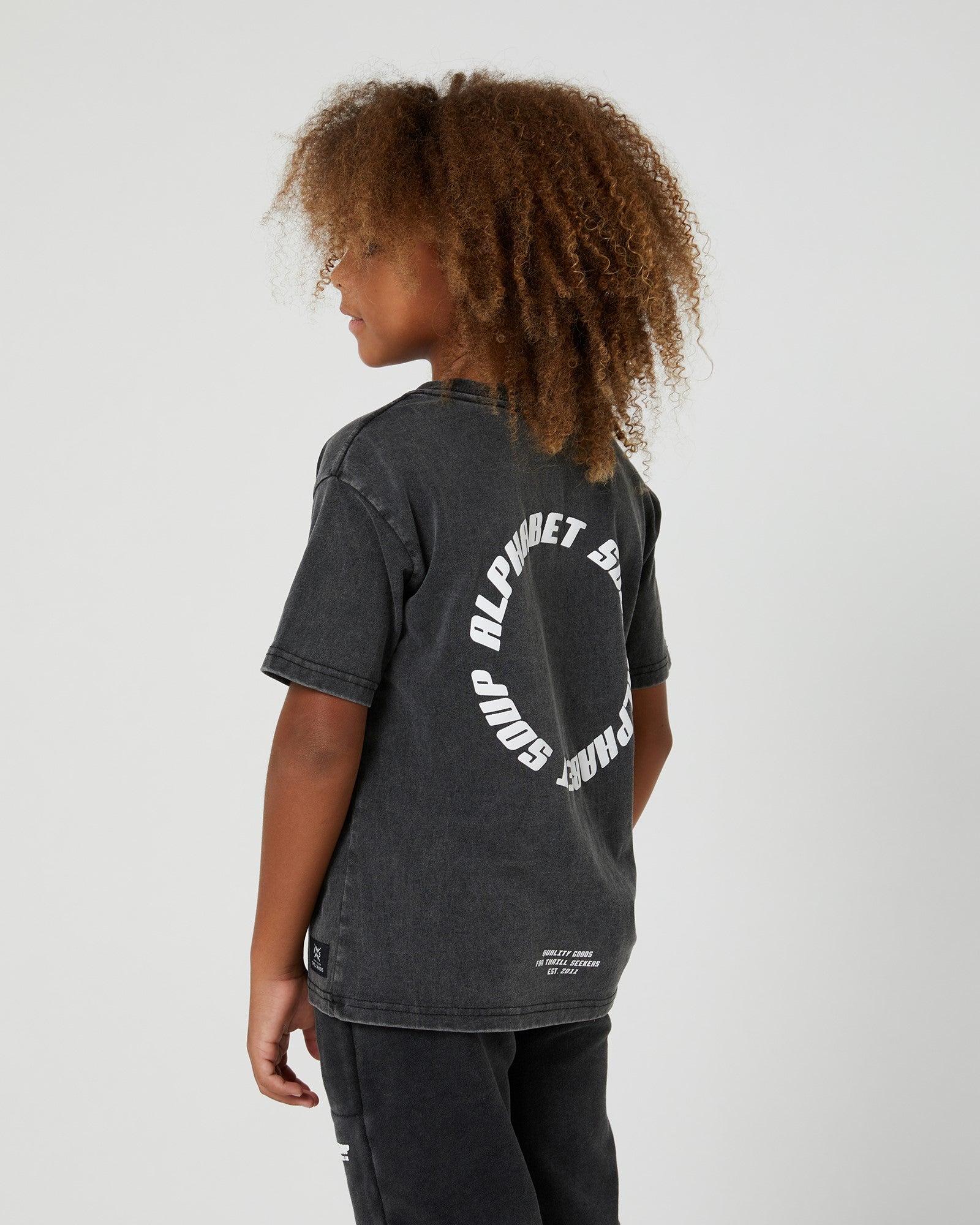 Kids San Clemente Tee from Alphabet Soup. 100% cotton with vintage dye wash. Puff logo print. Straight hemline, short sleeves. Comfortable and casual.