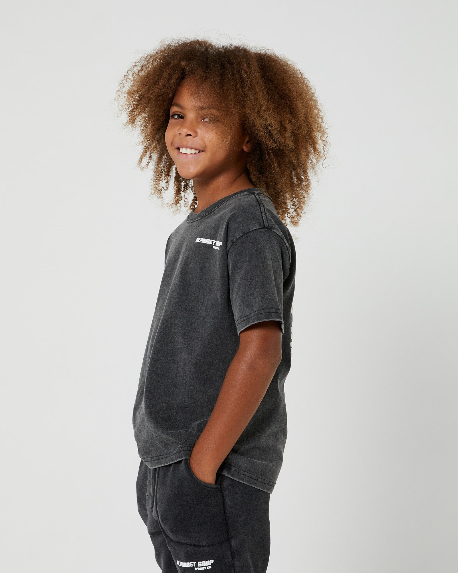 Teen Boys San Clemente Tee from Alphabet Soup. 100% cotton with vintage dye wash. Puff logo print. Straight hemline, short sleeves. Comfortable and casual.