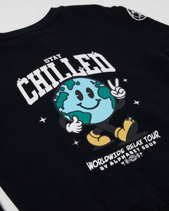 The Kids Black Stay Chilled Crew by Alphabet Soup is a comfortable jumper with a crew neck, long sleeves, and bold embroidered art designs on the front and arms. It also features ribbed cuffs and a hemline for a snug fit, and a woven brand patch for a skater-inspired look.