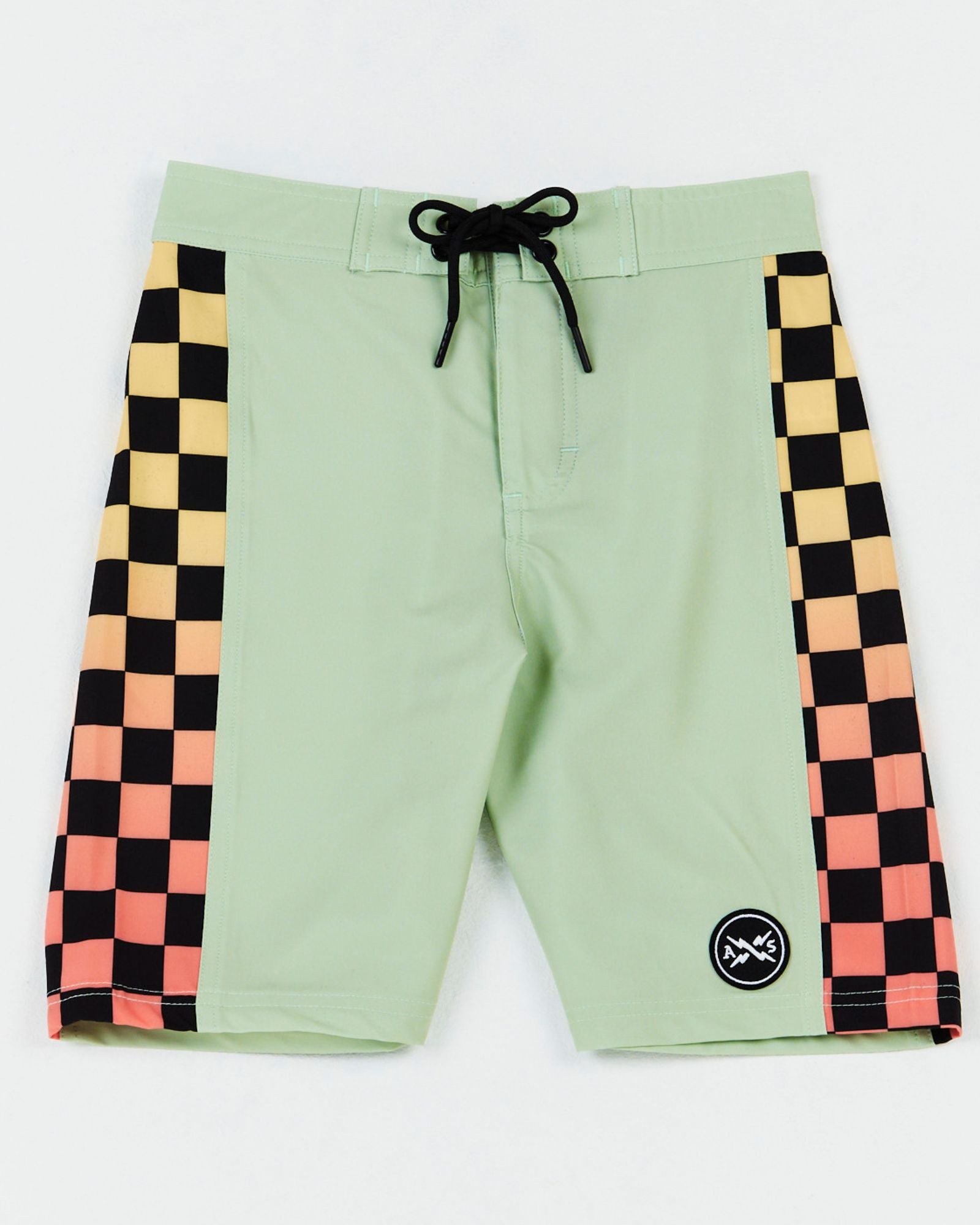Alphabet Soup’s Kids Eat My Dust boardshort for boys aged 2-7, featuring a quick-dry 4-way stretch fabric featuring a double eyelet waist drawstring, elasticized back waist, checkered fade print, side panel detail, and a velcro-fastened back pocket with logo badge.