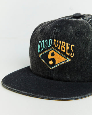 Good Vibes Cap by Alphabet Soup for boys aged 2-16. Crafted in durable cotton canvas with adjustable snap fastening, acid black wash, multicoloured embroidery, and classic 6-panel trucker design with “Good Vibes” multi coloured embroided artwork to front.