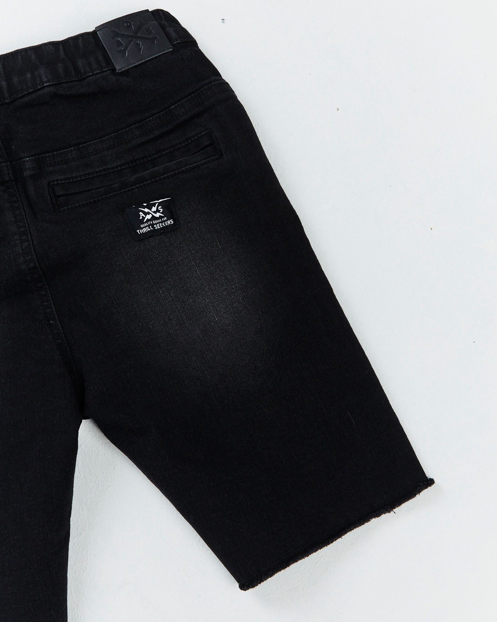 Alphabet Soup's Teen Reckless Denim Jogg Jean Shorts for boys aged 8-16. Crafted from stretch knit denim and vintage black, perfect for any marathon of adventure. Relaxed fit, elasticated waist, five pocket design.