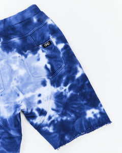 Kids Cloud Surfer Short by Alphabet Soup. Relaxed fit, 100% cotton French Terry with elastic waist, adjustable drawcord and faux fly provide dreamy comfort. Stylish marble tie dye and embroidery under pocket.