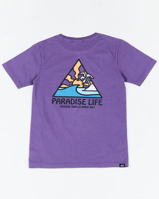 Alphabet Soup's Kids Thruster Tee for boys aged 2-7. Crafted from 100% Cotton Jersey. A purple pigment dye tee, regular fit, straight hemline, short sleeves, ribbed crew neckline, and a retro surf “Paradise Life” print to chest and back.
