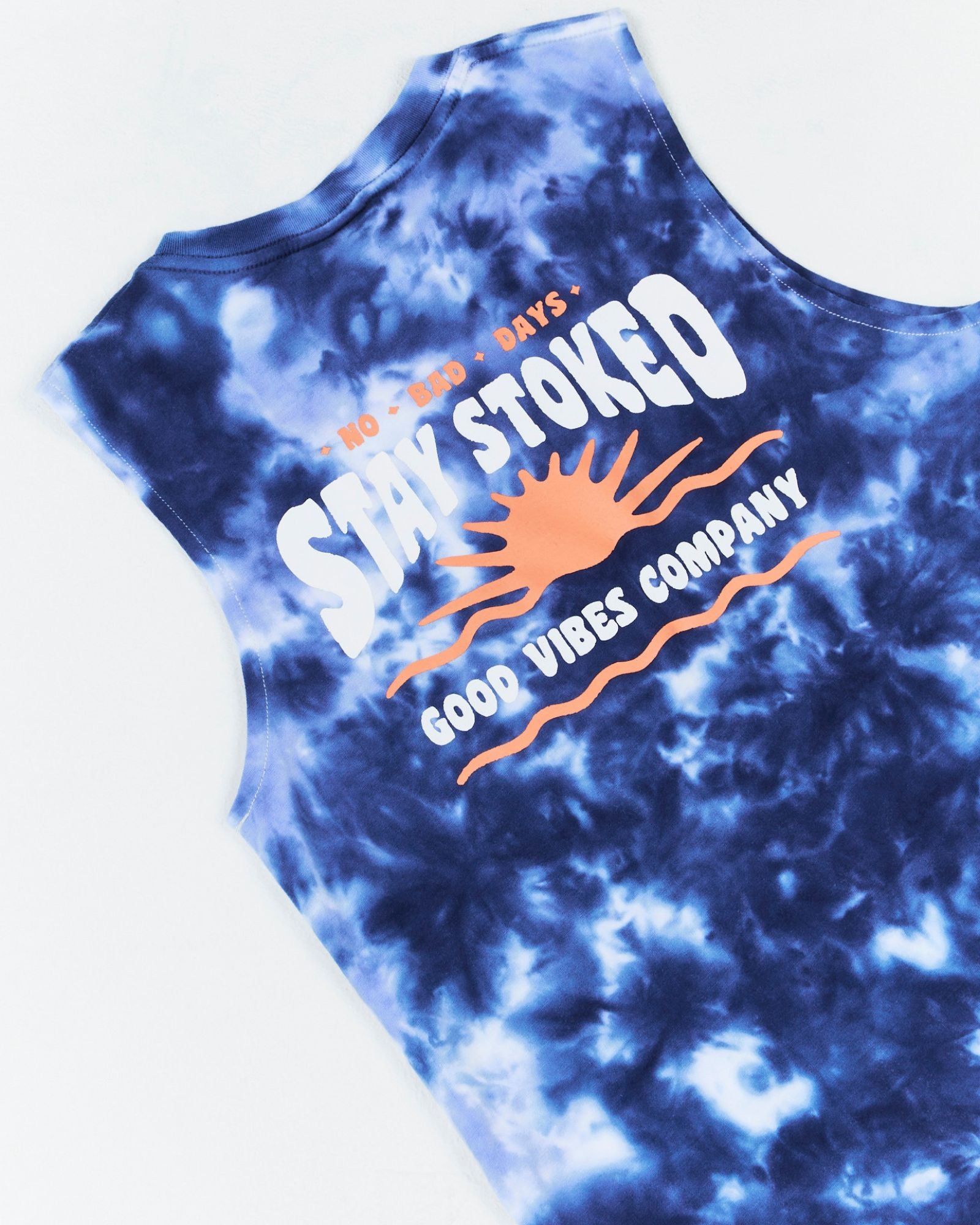 Alphabet Soup's Kids Cloud Surfer Tank for boys aged 2-7, is crafted from 100% cotton jersey. It has a straight hem, ribbed crew neckline, and marble tie dye with a woven label on the hem. Plus, it features “Stay Stoked” prints on the chest and back.