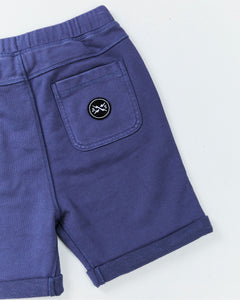 Alphabet Soup's Kids Comfy Shorts for boys aged 2-7. Featuring pigment dye print, heavy weight cotton, adjustable drawcord waist, rolled hem, faux fly, twin hand pockets, embroidered front pocket, back pocket logo patch.