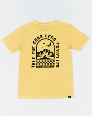 Alphabet Soup's Kids Mystical Tee in washed yellow cotton jersey for boys ages 2-7. Featuring a rad print “Take The Road Less Travelled” design on front and back, short sleeves, crew neck, and straight hemline.