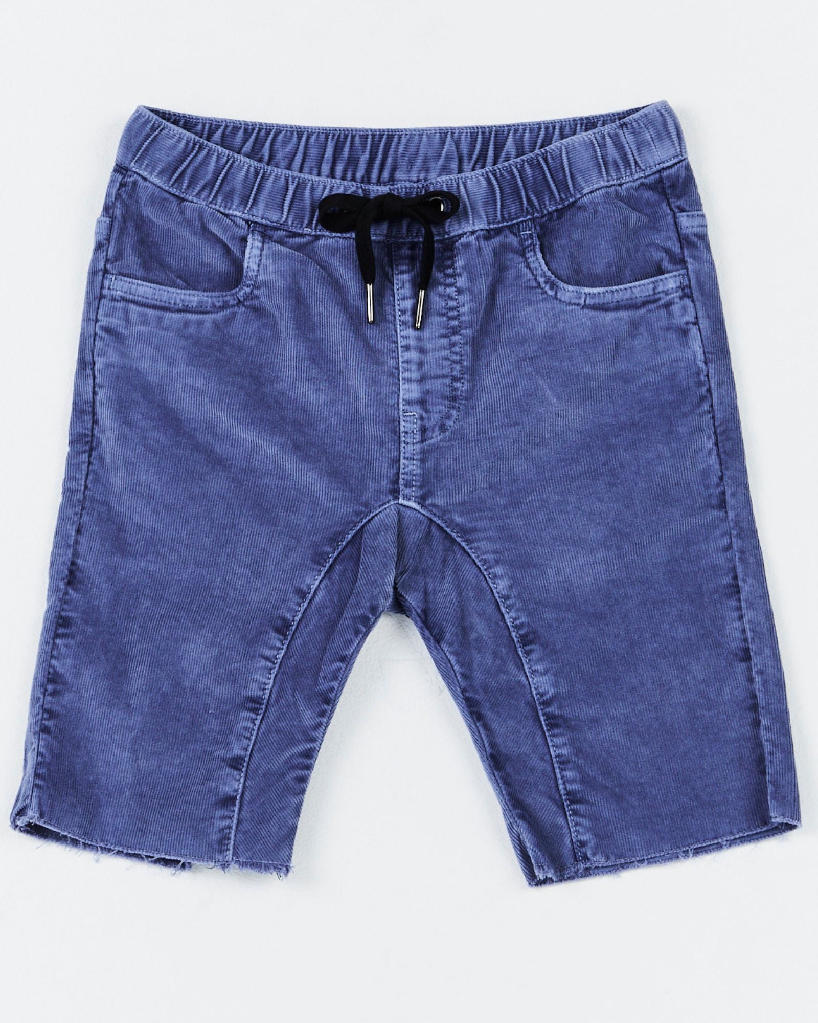 Alphabet Soup's Kids Trusty Cord Shorts for boys aged 2-7.  Crafted with cotton corduroy in blue enzyme wash with stretch, including adjustable waist, raw hem, faux fly, hip & back pockets with bolt embroidery.