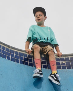 Alphabet Soup's Teen Frothy Tee for boys aged 8-16. Featuring cotton jersey, boxy fit, short sleeves, ribbed crewneck, straight hemline, green tie-dye print, puff chest print.
