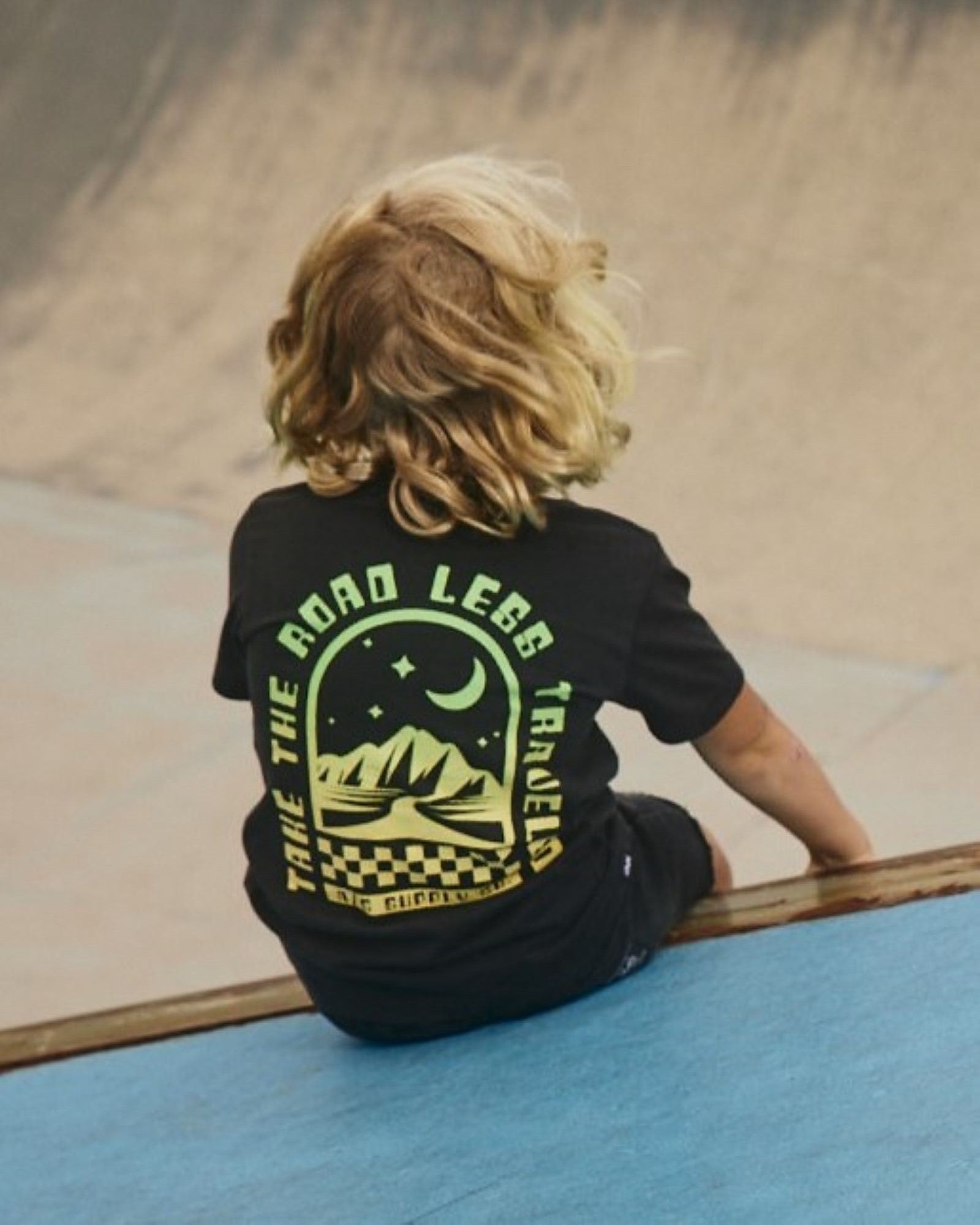Alphabet Soup's Teen Mystical Tee in washed black cotton jersey for boys ages 8-16. Featuring a rad print “Take The Road Less Travelled” design on front and back, short sleeves, crew neck, and straight hemline.