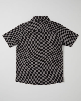 Alphabet Soup's Teen Warped Short Sleeve Shirt for boys aged 8 to16. Crafted of 100% cotton with a vintage-washed finish, comfy classic fit, button-through placket, open chest pocket, and curved hemline—plus an extra-cool checkerboard pattern and woven clip label.